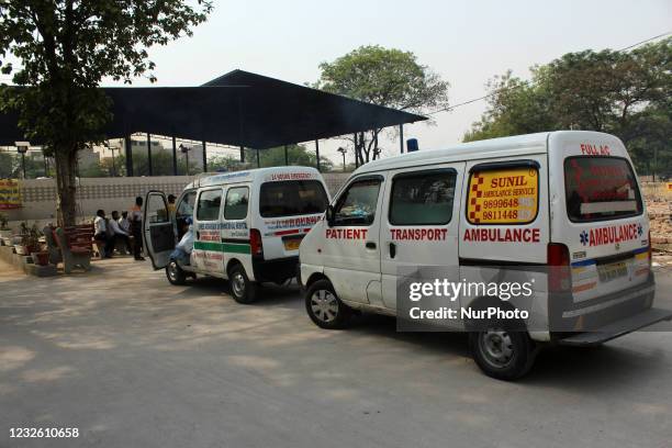 Ambulances carrying the bodies of victims, who died due to the coronavirus disease , queue up at a crematorium in New Delhi on April 30, 2021. India...