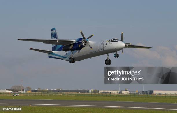 An Antonov An-26B plane leaves the Oostende-Bruges Airport loaded with medical drugs towards India on April 30, 2021. - Belgium sends a cargo of...