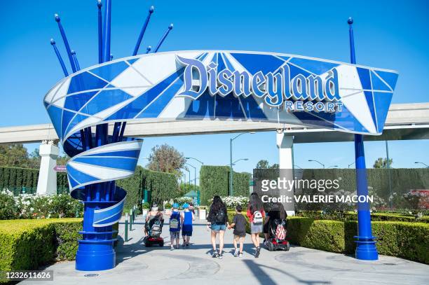 Visitors enter Disneyland on the day of the park's re-opening on April 30 in Anaheim, California.