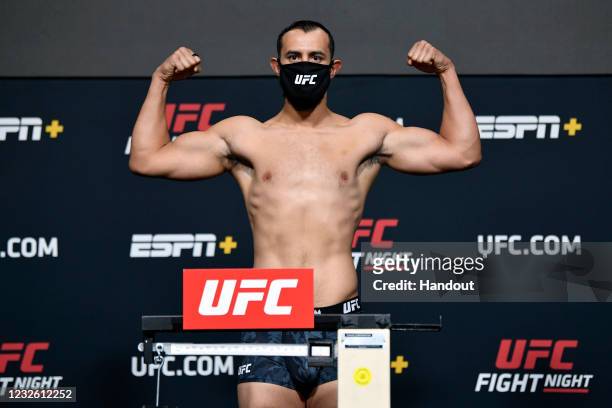 In this UFC handout, Dominick Reyes poses on the scale during the UFC weigh-in at UFC APEX on April 30, 2021 in Las Vegas, Nevada.