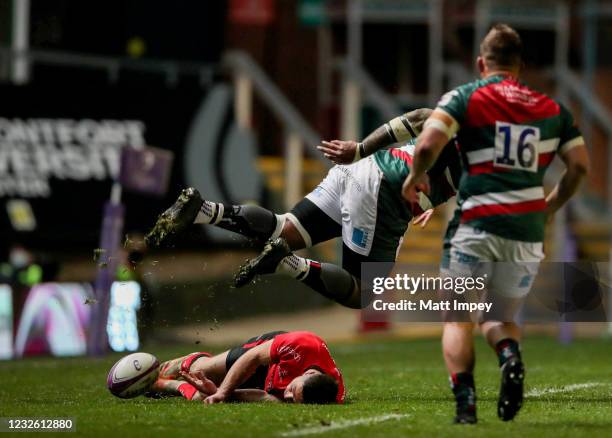 England , United Kingdom - 30 April 2021; John Cooney of Ulster goes down after being caught by Nemani Nadolo of Leicester Tigers before leaving the...