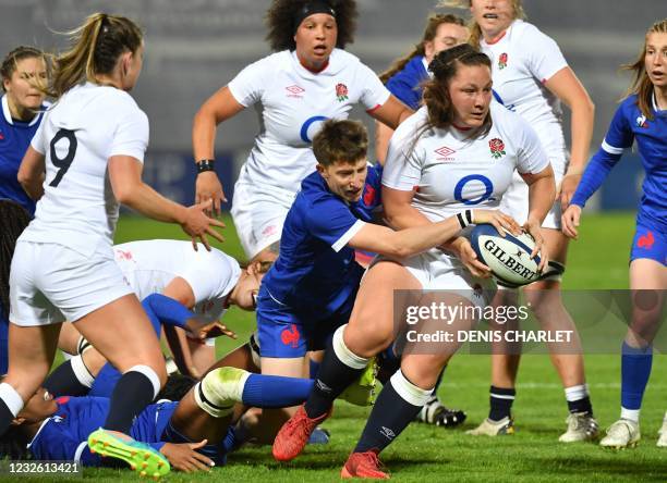 France's fullback Elise Pignot fights for the ball during the Women's Rugby Union Test match between France and England, at The Lille-Metropole...