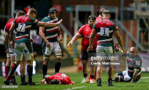 England , United Kingdom - 30 April 2021; John Cooney of Ulster lies injured after being caught by Nemani Nadolo of Leicester Tigers, right, before...