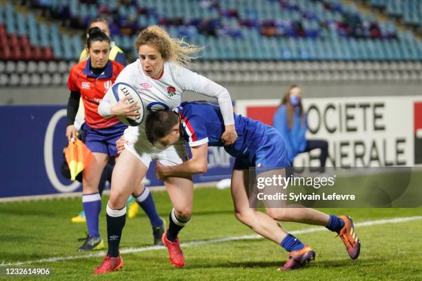 Abby Dow is tackled by Elise Pignot of France during the women's international friendly match between France and England on April 30, 2021 in...