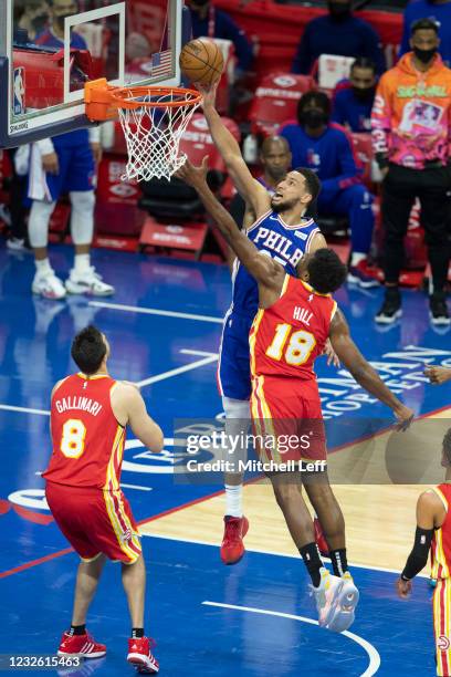 Ben Simmons of the Philadelphia 76ers shoots the ball against Solomon Hill of the Atlanta Hawks in the first quarter at the Wells Fargo Center on...