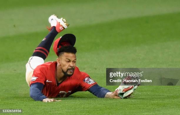 Byron Buxton of the Minnesota Twins makes a catch in center field of the ball hit by Andrew Benintendi of the Kansas City Royals during the fifth...