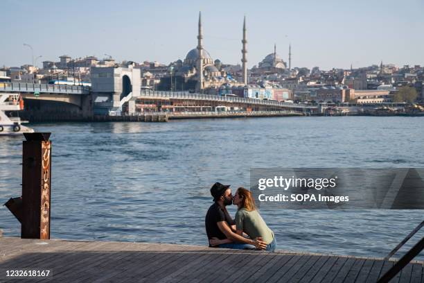 Tourist couple seen kissing at the Golden Horn. The Turkish government has announced a 17 day curfew in an attempt to fight the growing number of...