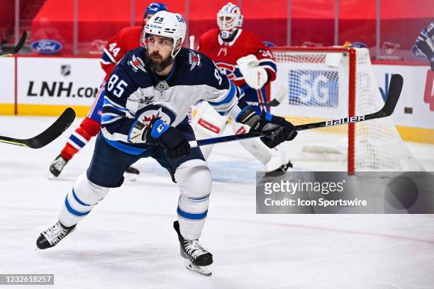 Winnipeg Jets left wing Mathieu Perreault skates fast while tracking the play on his right during the Winnipeg Jets versus the Montreal Canadiens...