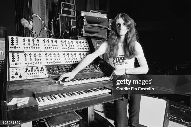 Geddy Lee, singer and bassist with Canadian rock band Rush, poses beside a synthesizer during a soundcheck ahead of the band's gig at the Gaumont in...