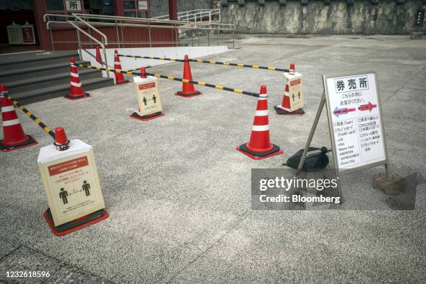 Notices reminding people to observe social distancing measures at the Shuri Castle in Naha, Okinawa, Japan, on Wednesday, April 28, 2021. Until...