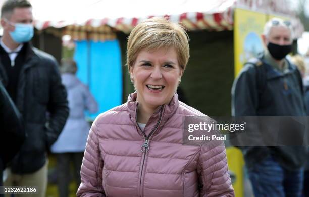 Scottish First Minister and leader of the Scottish National Party Nicola Sturgeon laughs as she visits Perth Farmers Market as she campaigns on May...