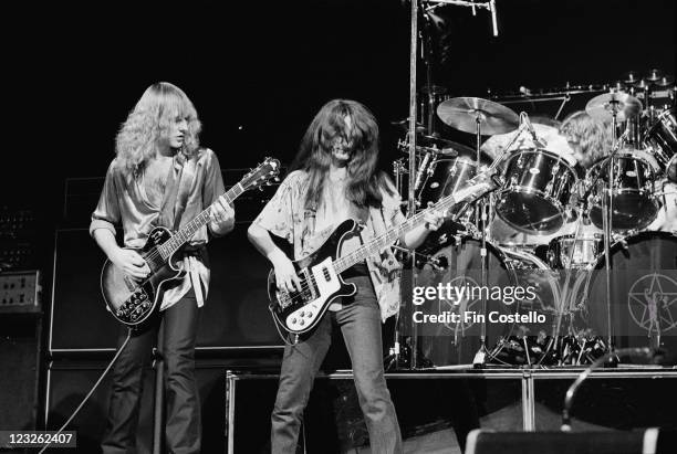Alex Lifeson , guitarist, and Geddy Lee, singer and bassist with Canadian rock band Rush, on stage during a live concert performance by the band at...