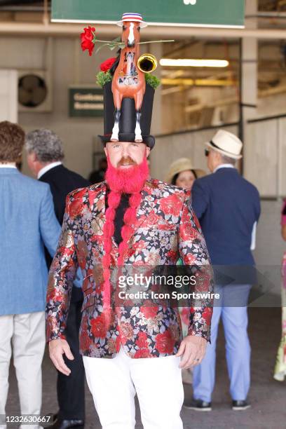 This passionate derby fan shows his love for derby with his run for the roses attire and hat during the 147th running of the Kentucky Derby on May...