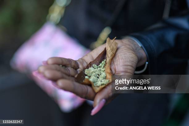 Person rolls a 'joint' during the NYC Cannabis Parade & Rally in support of the legalization of marijuana for recreational and medical use, on May 1,...