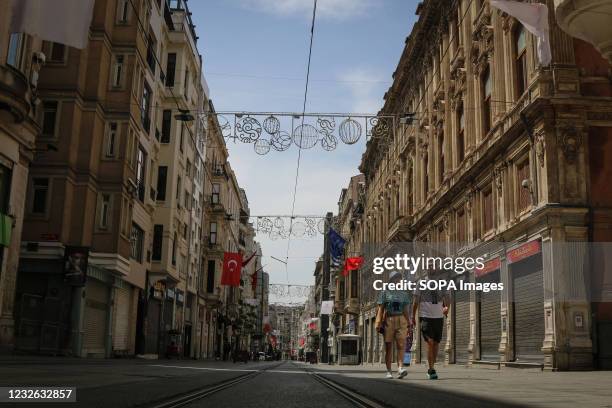 Istiklal Street, one of the most famous places in Istanbul, where only tourists are allowed to enter is pictured almost empty during the May Day...