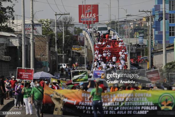 Demonstrators take part in International Labor Day march in Tegucigalpa, Honduras on May 01, 2021