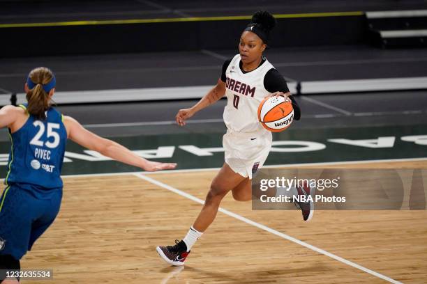 Odyssey Sims of the Atlanta Dream moves the ball against the Minnesota Lynx on May 1, 2021 at The Gateway Center Arena in College Park, Georgia. NOTE...