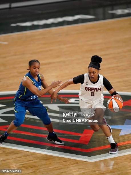 Odyssey Sims of the Atlanta Dream handles the ball against the Minnesota Lynx on May 1, 2021 at The Gateway Center Arena in College Park, Georgia....
