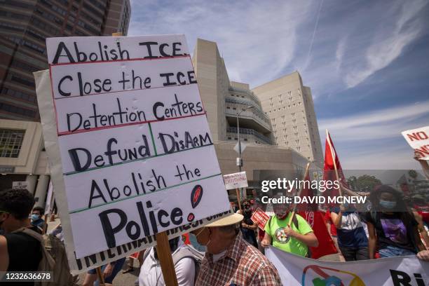 People protesting ICE detention centers pass The Metropolitan Detention Center, Los Angeles, where many undocumented immigrants are held in custody,...