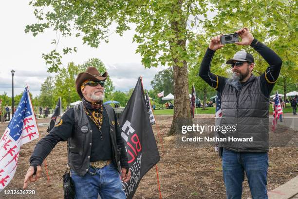 Flip Todd , Vice President of the Portland Proud Boys chapter, and Proud Boy Daniel Tooze provide security at a 2nd Amendment Rally on May 1, 2021 in...