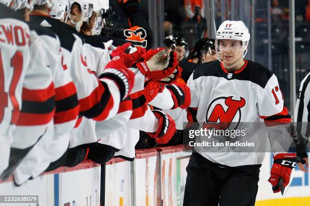 Yegor Sharangovich of the New Jersey Devils celebrates his third period goal against the Philadelphia Flyers with his teammates on the bench at the...