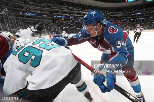 Carl Soderberg of the Colorado Avalanche fights for position against Rudolfs Balcers of the San Jose Sharks at Ball Arena on May 01, 2021 in Denver,...