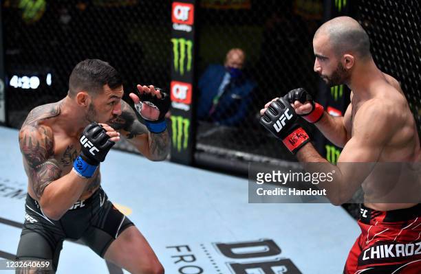 In this UFC handout, Cub Swanson battles Giga Chikadze of Georgia in a featherweight bout during the UFC Fight Night event at UFC APEX on May 01,...