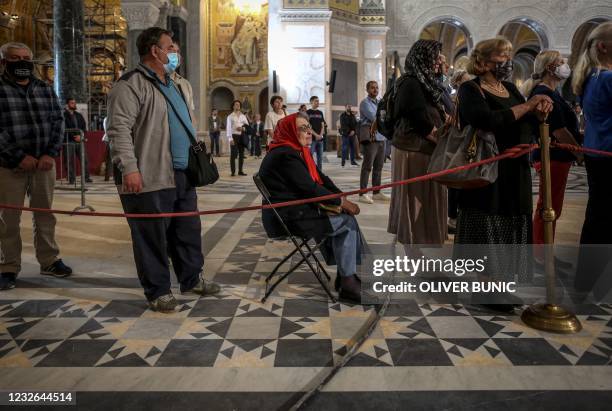 Worshippers attend an Orthodox Easter service at St. Sava Church in Belgrade, Serbia on May 2, 2021.