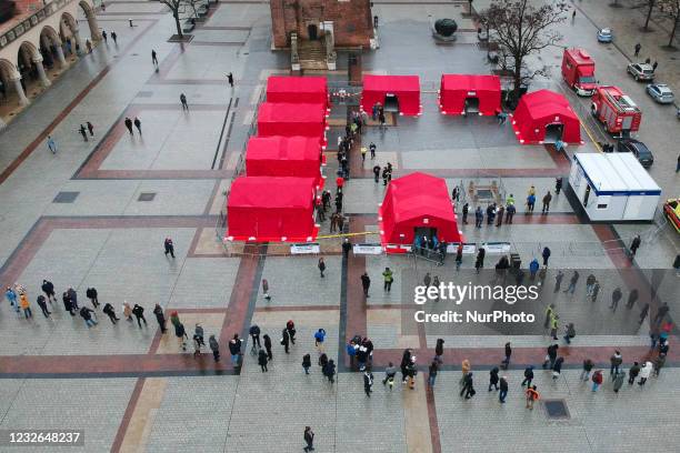 An aerial view of people standing in a long line to receive the one-dose Johnson &amp; Johnson COVID-19 vaccine at the mobile vaccination point at...