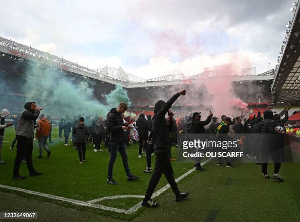 Supporters protest against Manchester United's owners, inside English Premier League club Manchester United's Old Trafford stadium in Manchester,...