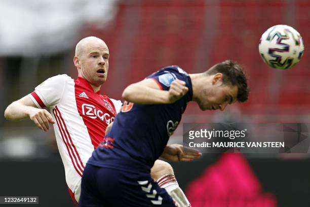 Emmen Dutch midfileder Jari Vlak heads the ball past Ajax's Dutch midfielder Davy Klaassen during the Dutch Eredivisie football match between Ajax...