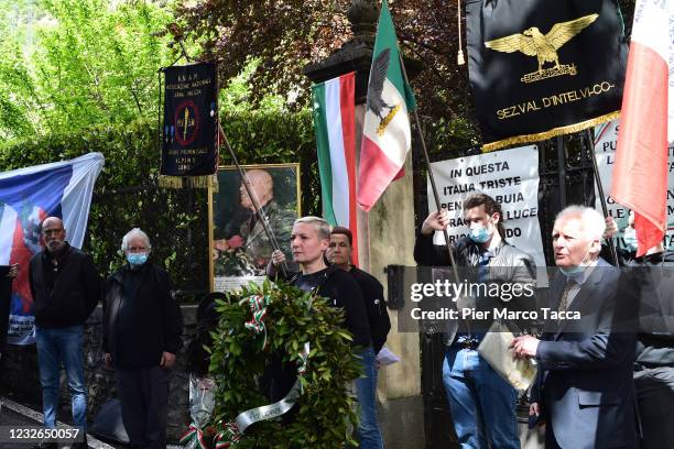 Some people attend the commemoration ceremony for the death of Italian dictator Benito Mussolini and his mistress, Claretta Petacci in front of a...