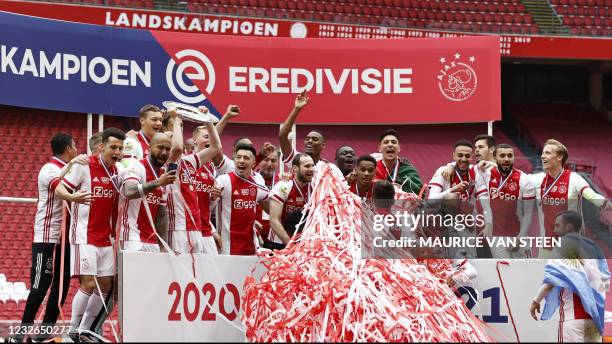 Ajax' players celebrate winning their 35th national title after the Dutch Eredivisie football match between Ajax Amsterdam and FC Emmen at the Johan...