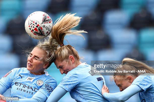 Alex Greenwood, Laura Coombs and Esme Morgan of Manchester City Women all defend with a headed challenge during the Barclays FA Women's Super League...