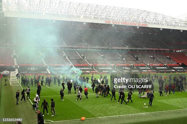 Supporters protest against Manchester United's owners, inside English Premier League club Manchester United's Old Trafford stadium in Manchester,...