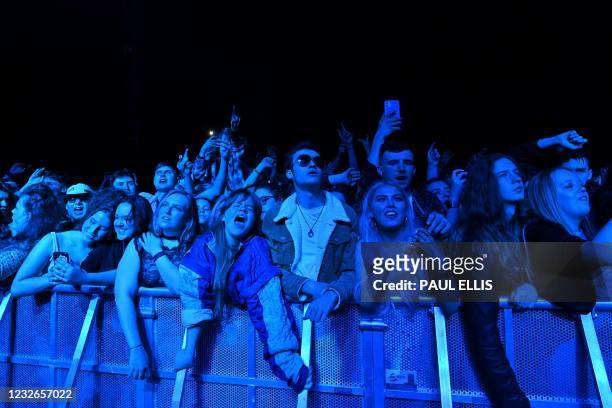 Fans watch Blossom perform at a live music concert hosted by Festival Republic in Sefton Park in Liverpool, north-west England on May 2 where a...