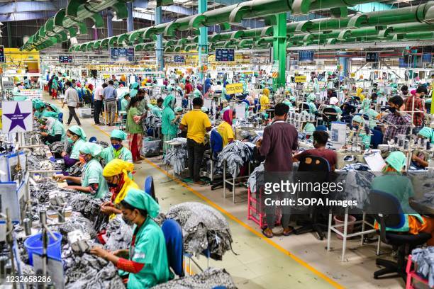 Garment workers work in a sewing section of the Fakhruddin Textile Mills Limited in Gazipur. All garment workers work following the rules and...
