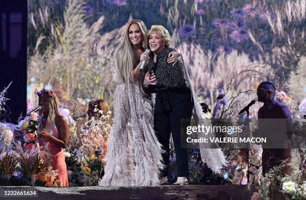 Singer Jennifer Lopez performs onstage with her mother Guadalupe Rodriguez during the taping of the "Vax Live" fundraising concert at SoFi Stadium in...