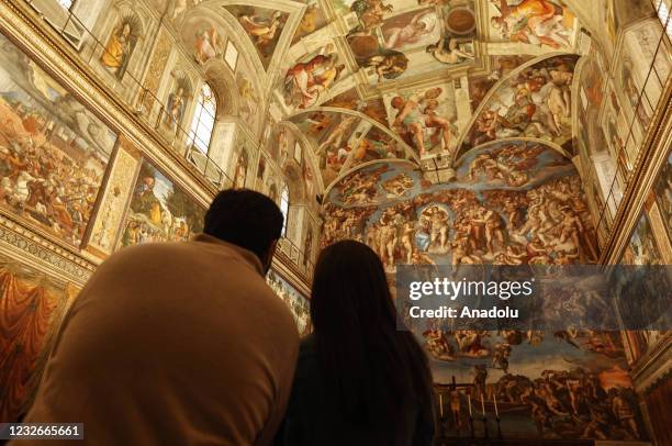 Tourist admire the Sistine Chapel, ahead of the re-opening of the Vatican Museums, at the Vatican City, on May 03, 2021. The re-opening follows the...