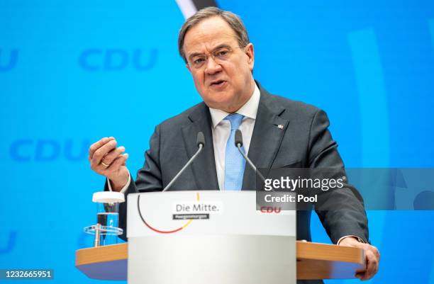 Armin Laschet, leader and chancellor candidate of the German Christian Democrats , speaks to the media during a press conference following a virtual...