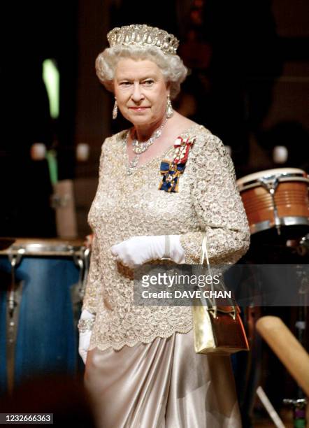Britain's Queen Elizabeth II arrives for a gala dinner 13 October 2002 in Gatineau, Quebec, Canada. Queen Elizabeth II is on the last leg of her...