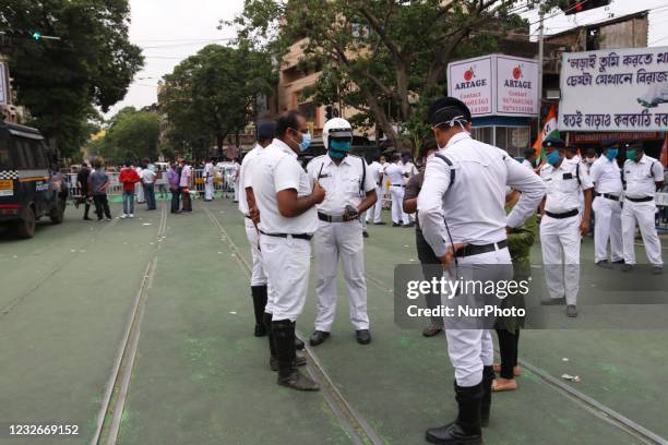 Police try to imperilment covid-19 Protocol ,Supporters of Trinamool Congress party celebrate their party's lead in the West Bengal state legislative...