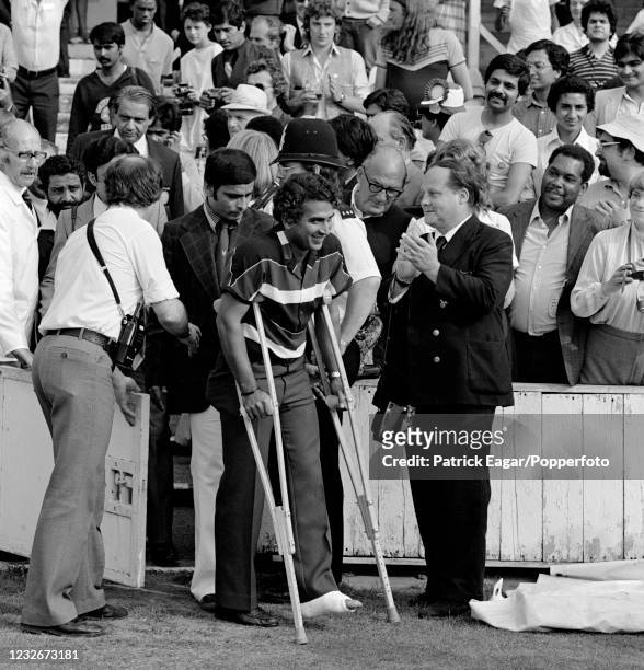 Sunil Gavaskar of India, with his foot in plaster, makes his way onto the field for the presentation ceremony after the 3rd Test match between...