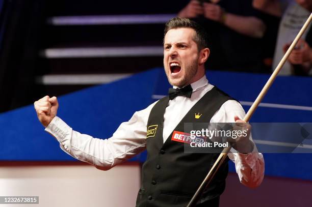 Mark Selby of England celebrates victory during the Final between Shaun Murphy and Mark Selby on day seventeen of the Betfred World Snooker...