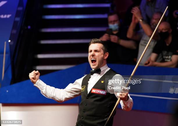 Mark Selby of England celebrates victory during the Final between Shaun Murphy and Mark Selby on day seventeen of the Betfred World Snooker...