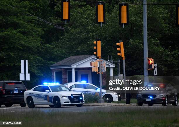 Police cars are seen outside the CIA headquarters's gate after an attempted intrusion earlier in the day in Langley, Virginia, on May 3, 2021. - An...