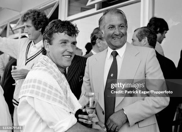 David Smith of Warwickshire is congratulated by former Worcestershire and England cricketer Basil D'Oliveira after being named man of the match for...