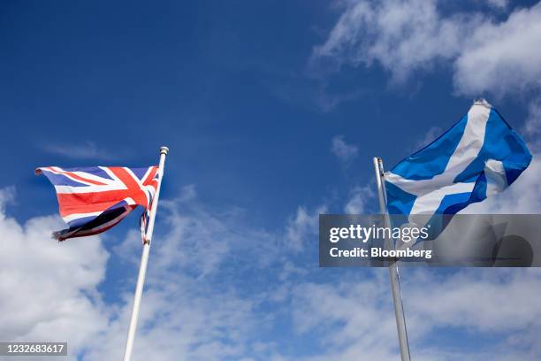 The British Union flag, also known as the Union Jack, left, and the saltire, the national flag of Scotland, right, in a garden in North Ayrshire,...