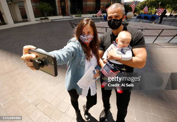 Anna West from Switzerland takes a selfie with her husband Toofun West who was recently naturalized and their 4-month-old baby Toofun Jr. Who is the...