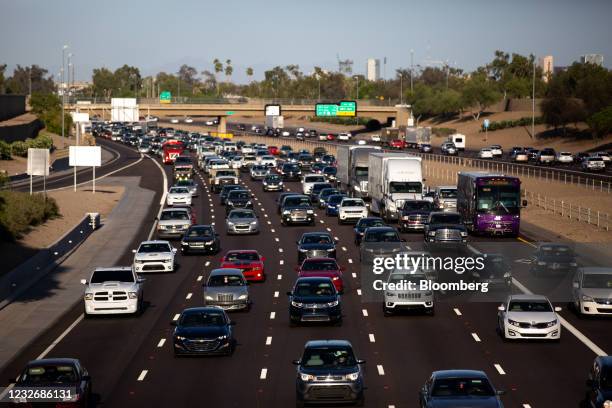 Vehicles travel on Interstate 10 during rush hour in Phoenix, Arizona, U.S., on Thursday, April 22, 2021. The U.S. Economy is on a multi-speed track...